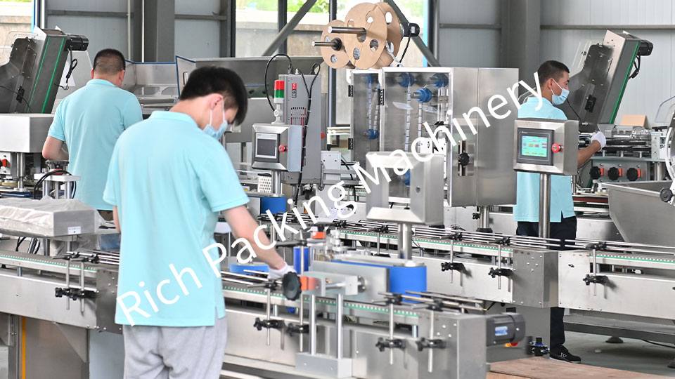 Workers are assembling machines in the counter workshop.